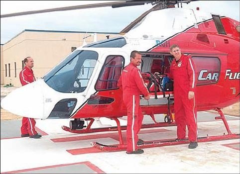 The CareFlight crew cleans out its helicopter Thursday at the Roosevelt General Hospital base.